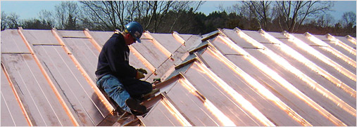 Man installing a copper roof