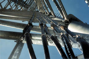 The #29X leads are bonded to 4/0 copper cables, which are connected to a horizontal bus on the tower structure