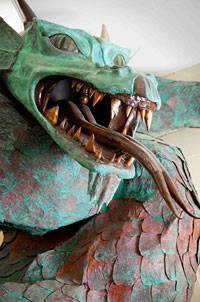 Dragon sculpture with patina.
