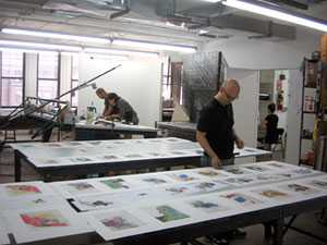 Arturo Herrera working on his collages