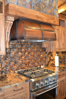 A carriage house hood over a kitchen stove