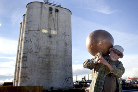 Dave Woodhead carries the copper ball