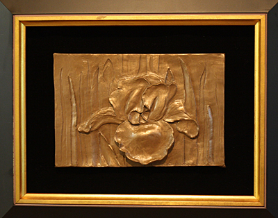 Finished bronze relief sculpture by Mary Button.