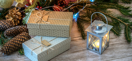 Christmas tree in background with gifts in forefront