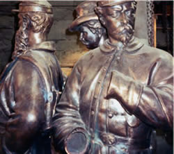 Original zinc statues from the Green-Wood Cemetery showing severe damage from vandalism and pitting.