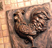 Copper embossed image of a rooster
