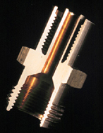 Cutaway view of a machined brass hose fitting. Note how much metal has been removed.